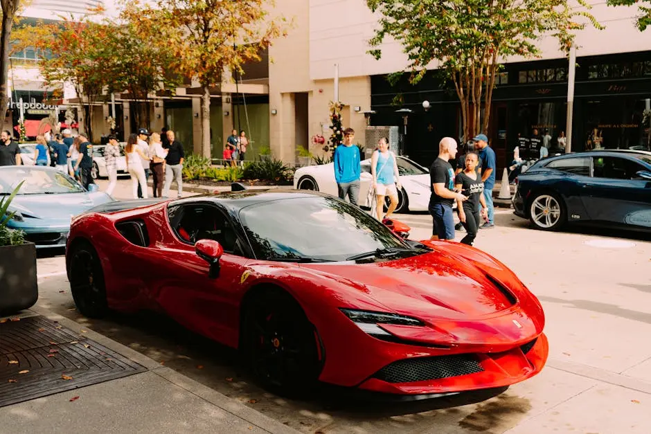 Luxurious red Ferrari parked street side with people walking by.