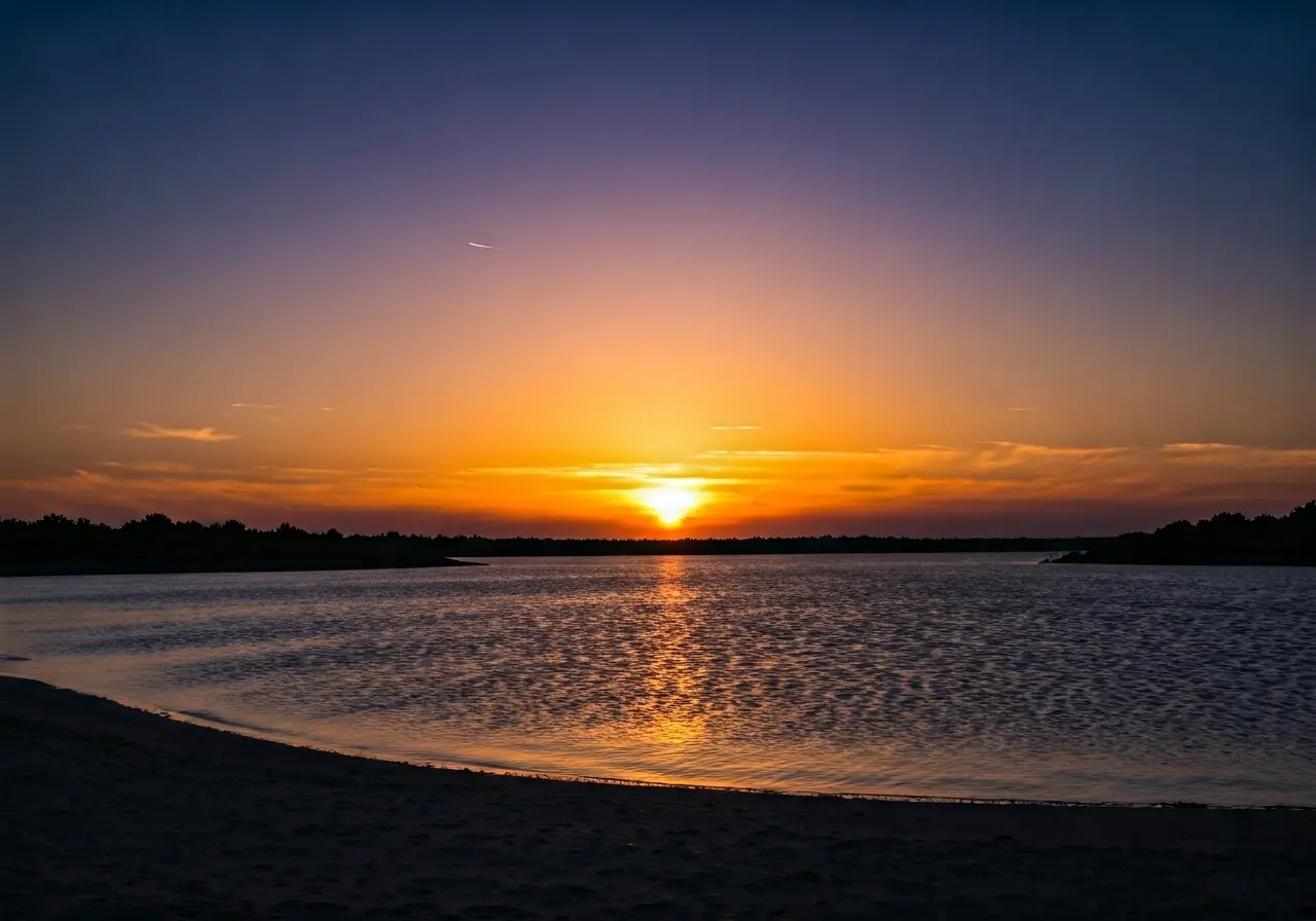 A serene sunset over a tranquil, peaceful landscape. 35mm stock photo