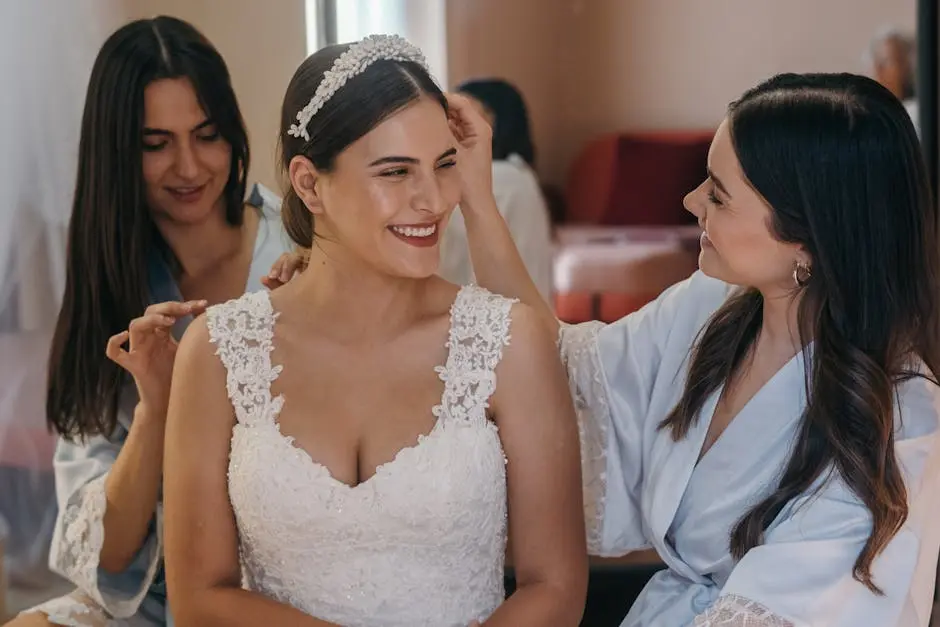 Bride with bridesmaids having a joyful moment while getting ready.