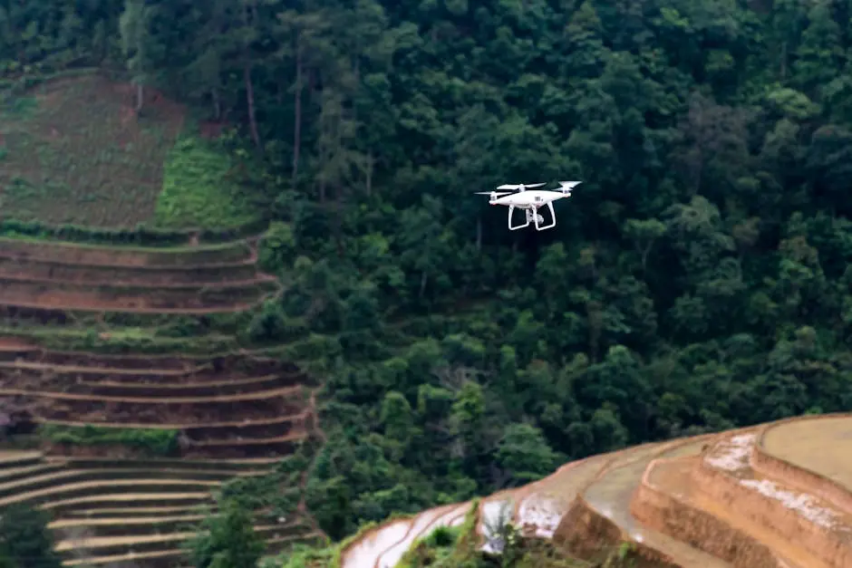 Drone flying over green rice terraces showcasing vibrant nature and advanced agriculture technology.