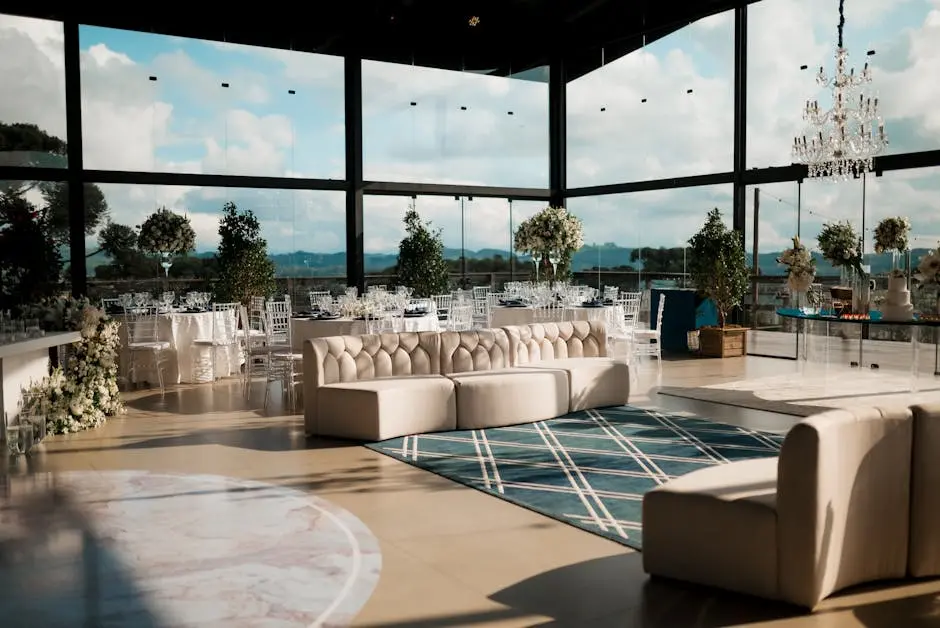 Spacious modern wedding venue with luxurious seating and panoramic views. Ideal for elegant events.
