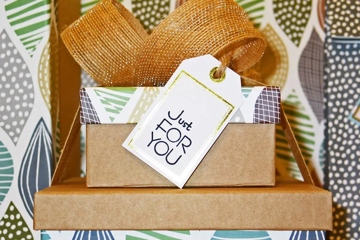A neatly wrapped gift box with decorative ribbon and ‘Just For You’ tag, perfect for celebrations.