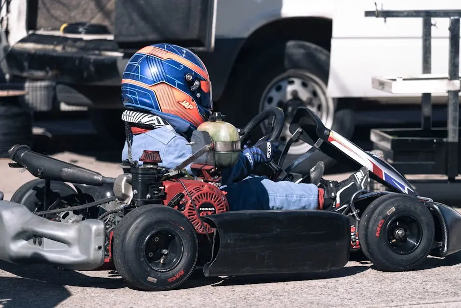 A thrilling close-up of a go-kart racer in full gear, capturing the speed and intensity of the sport.