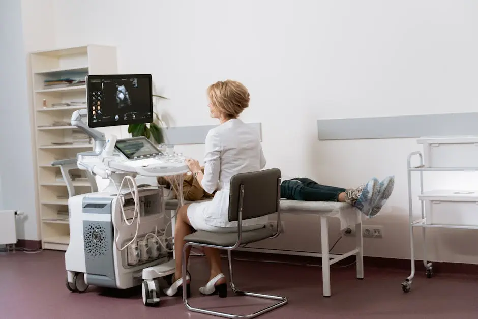 Doctor performing ultrasound scan on patient in modern clinic.