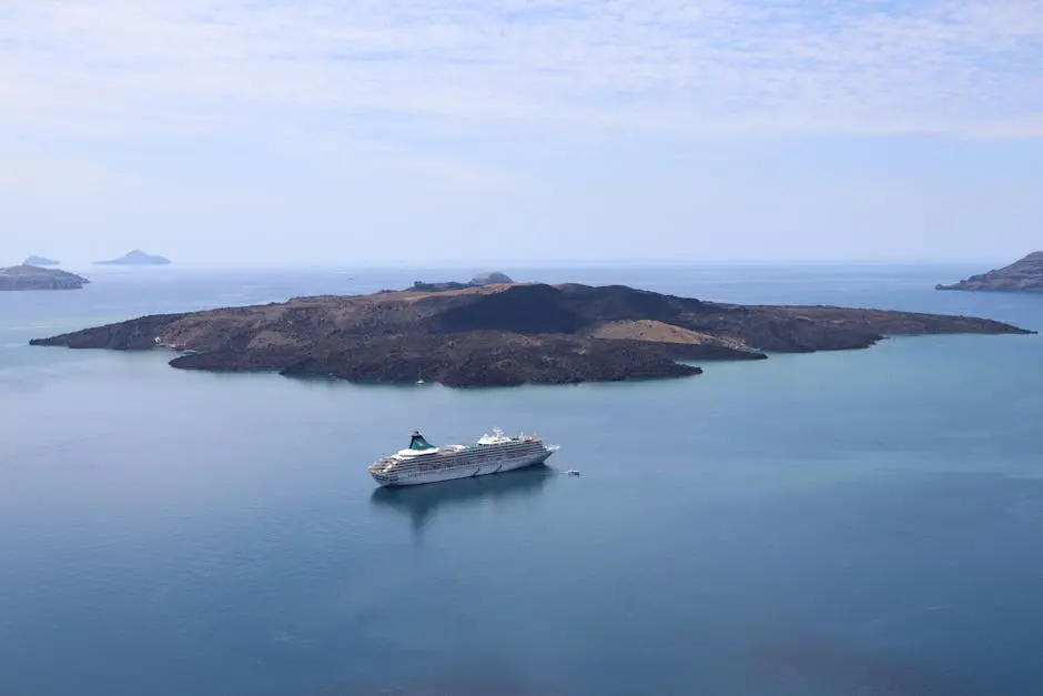 A cruise ship navigates near the volcanic island of Nea Kameni near Santorini, Greece.