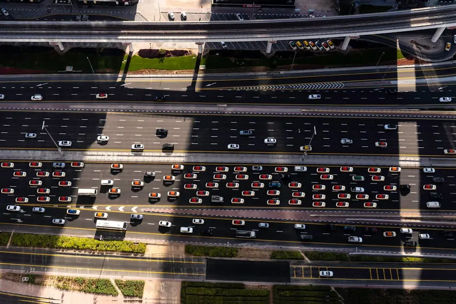 High angle view of busy traffic on Dubai highway, featuring cars and elevated roads.