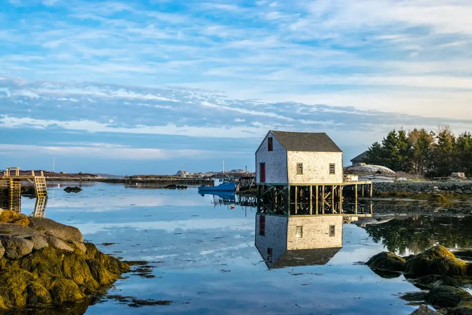 A serene landscape of a coastal house reflection in Nova Scotia, Canada.