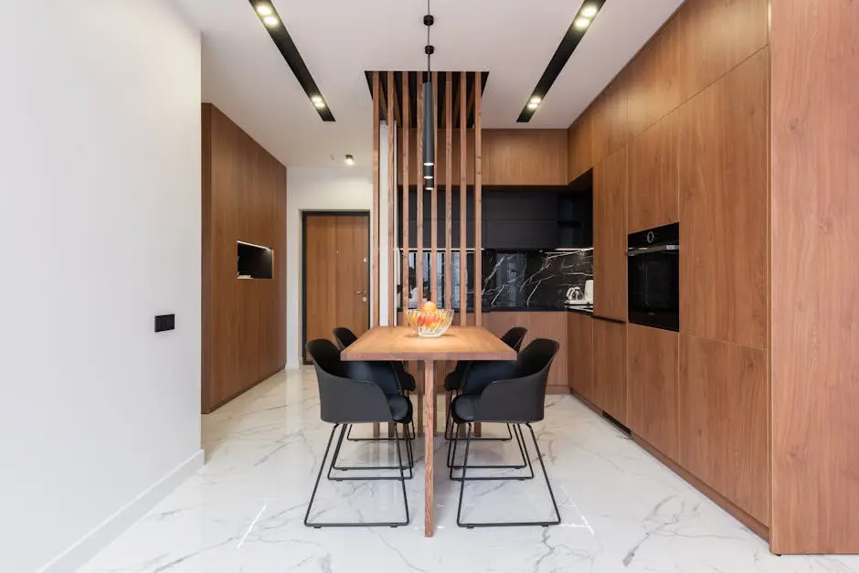Spacious and stylish kitchen interior with wooden cabinets and dining area.