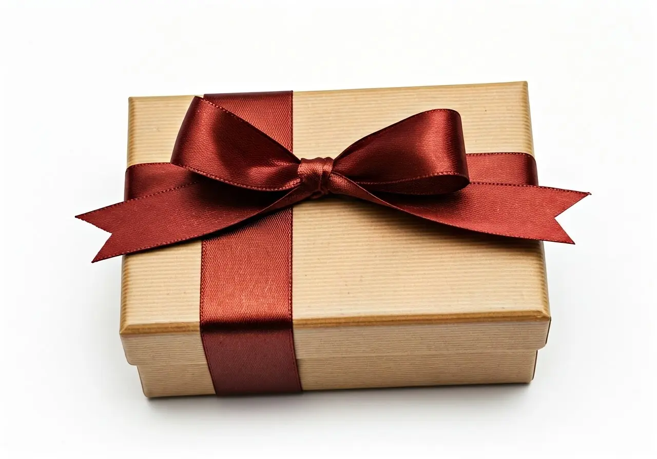 A neatly wrapped gift box with a branded ribbon. 35mm stock photo