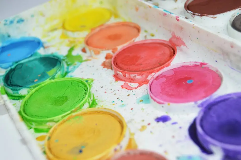 Close-up of a colorful watercolor paint palette showcasing vibrant hues for artistic creativity.