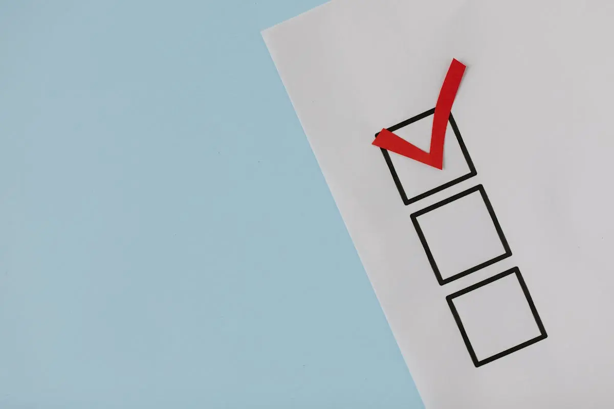 A simple white paper checklist with one red checkmark, Business Acquisition