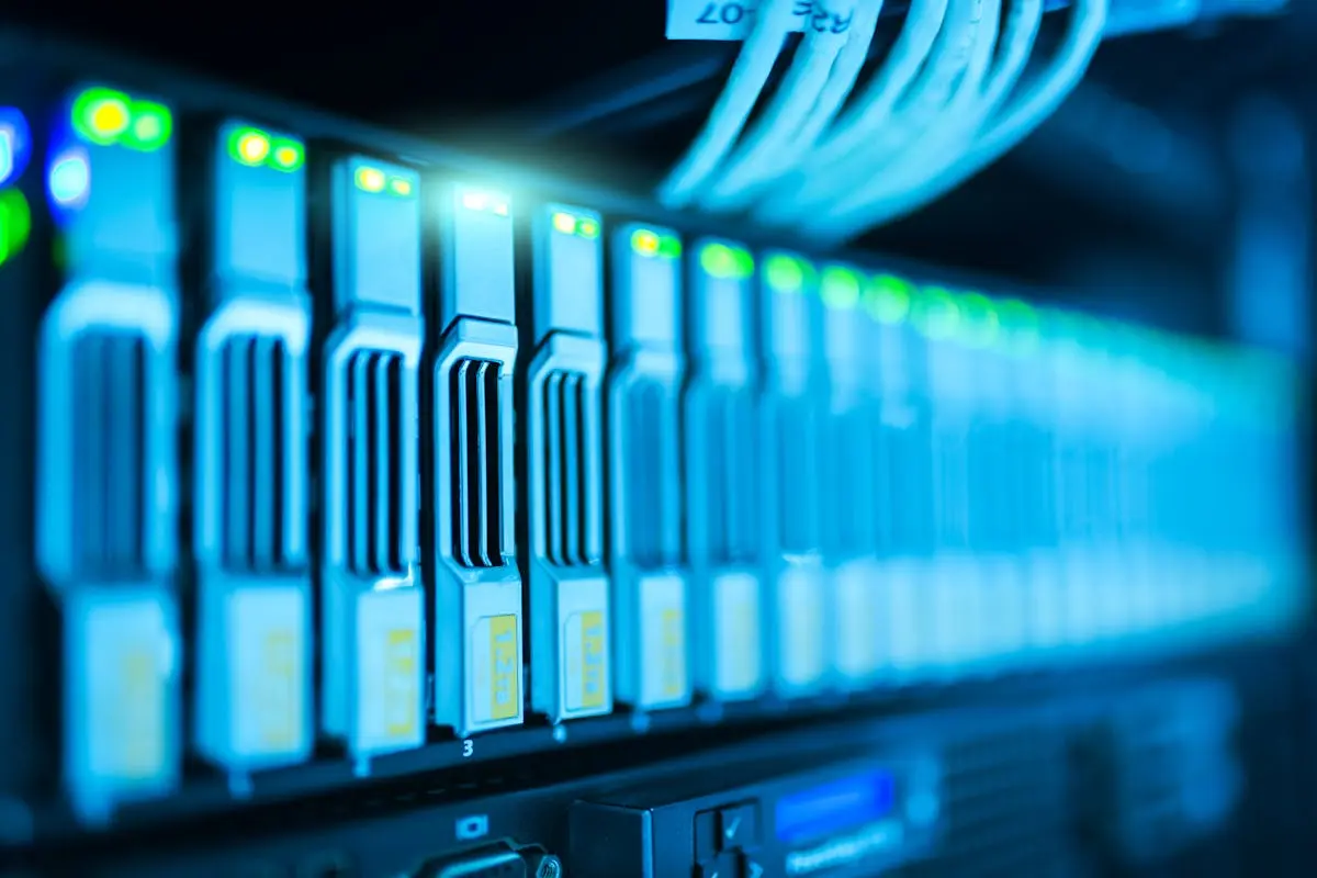 Detailed image of a server rack with glowing lights in a modern data center. technology strategy consulting