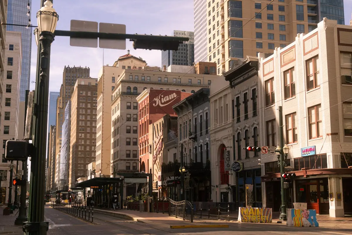 Charming street view of downtown Houston with historic buildings on a sunny day.