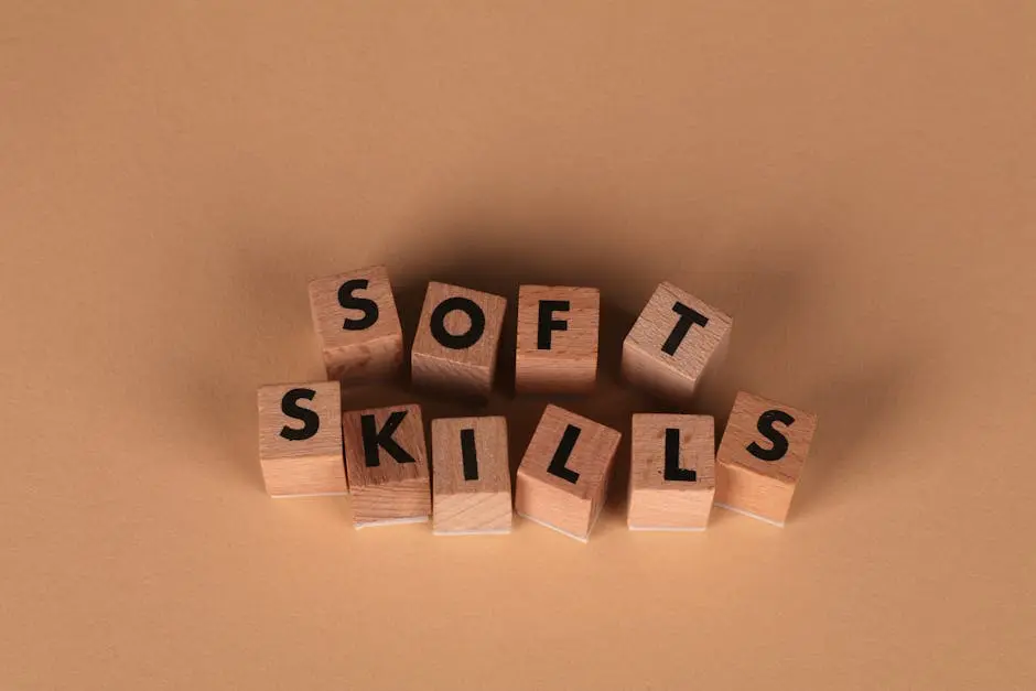 Wooden letter blocks spell out &lsquo;Soft Skills&rsquo;, highlighting business and personal development concepts.