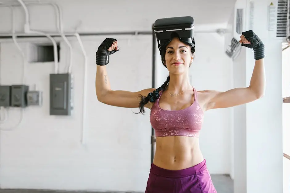 Woman flexes muscles with VR headset and gloves in gym, showcasing fitness technology.