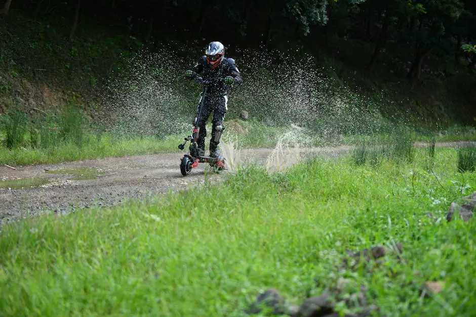 A man riding an electric scooter through a muddy path, splashing water in San Francisco