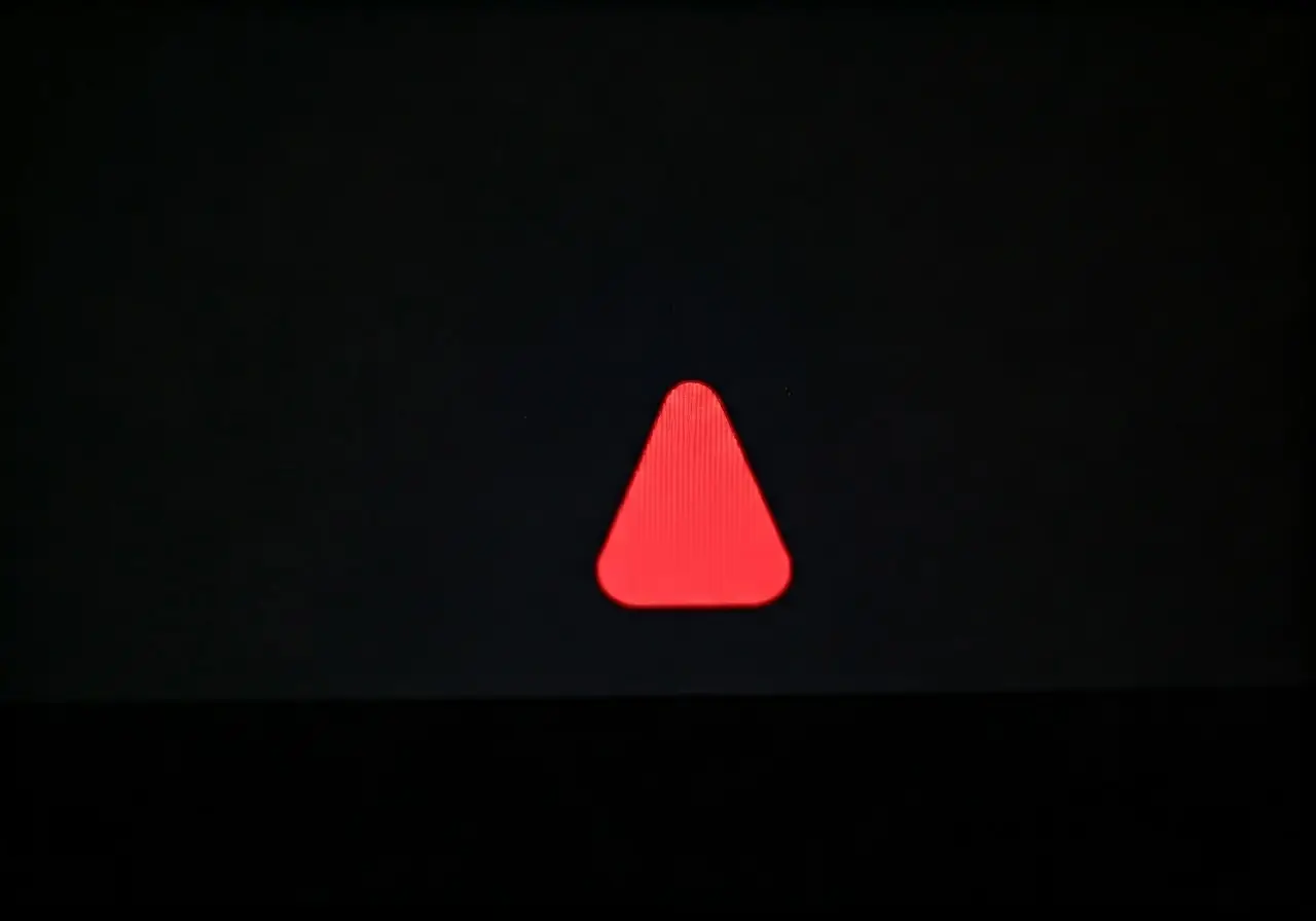 A computer screen displaying a red warning alert icon. 35mm stock photo