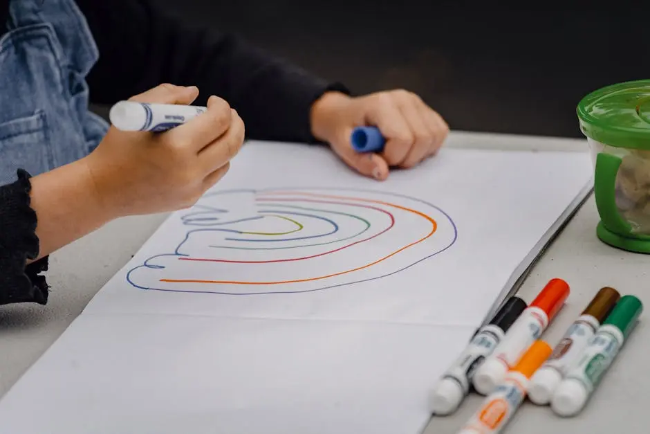 A child coloring a rainbow with vibrant markers on white paper, creating imaginative art.