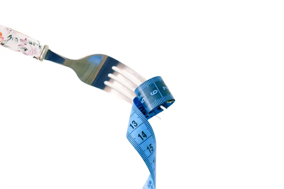 A fork twirls a blue measuring tape, symbolizing weight management and health.