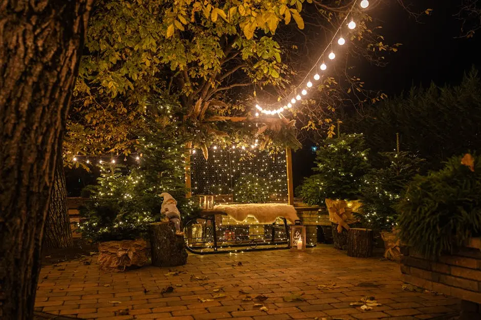 A cozy outdoor patio adorned with Christmas lights and decorations, creating a warm festive ambiance at night.