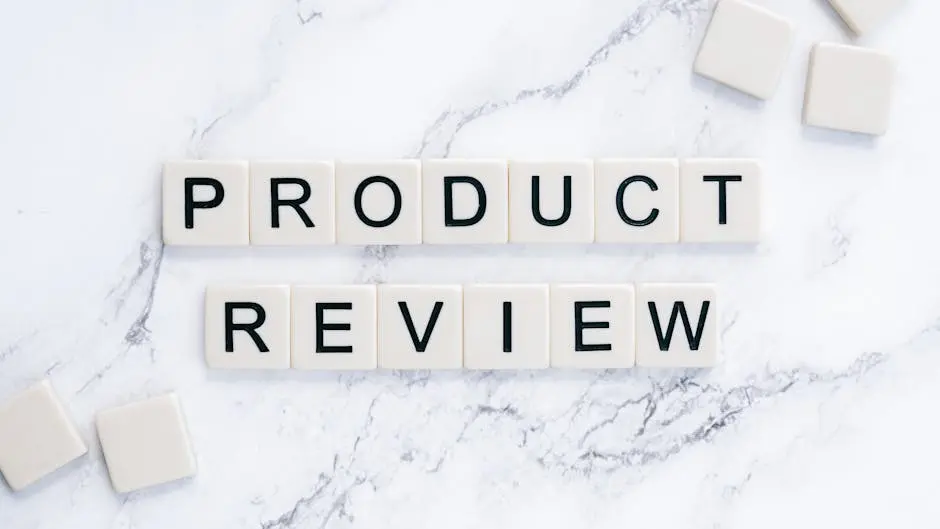 Scrabble tiles spelling ‘Product Review’ on a marble surface for conceptual illustration.