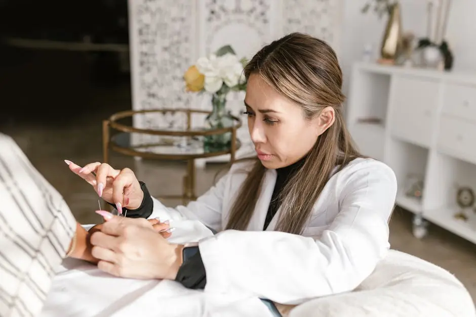 Acupuncturist providing holistic health treatment with focus and precision in a serene spa.