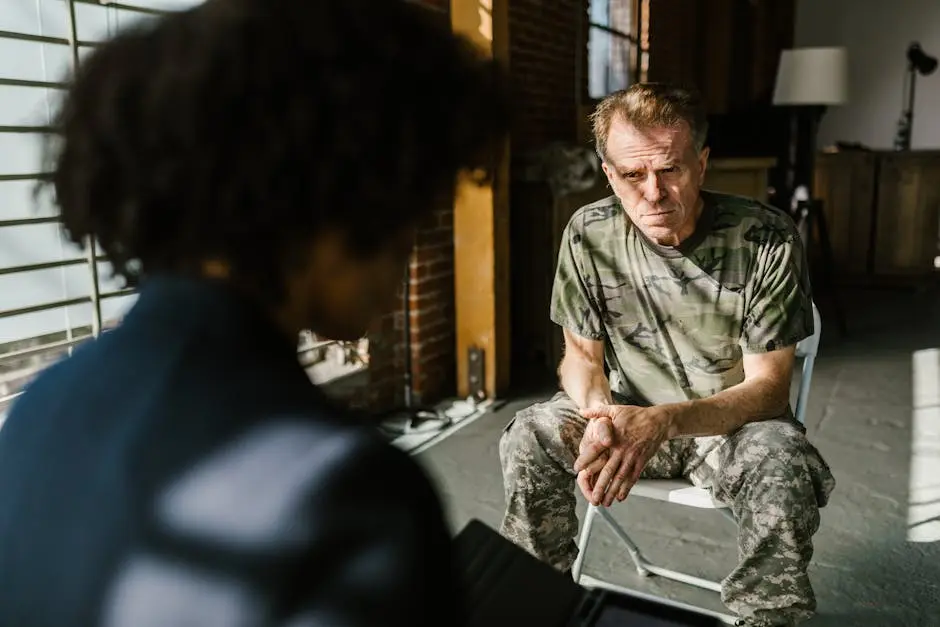 A soldier receiving counseling indoors, highlighting personal recovery.