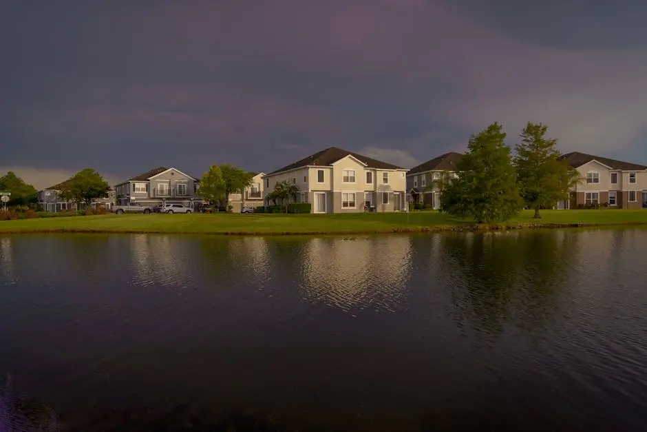 Scenic view of lakefront homes reflecting on water under a dramatic sky in Orlando.