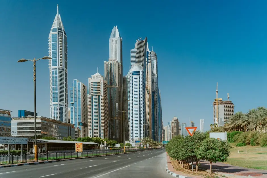 Tall skyscrapers in Dubai showcasing modern architecture and clear blue sky.