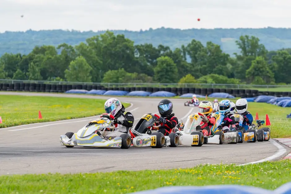 High-speed go-kart race on an outdoor track in Wampum, PA, with vibrant helmets and karts in action.