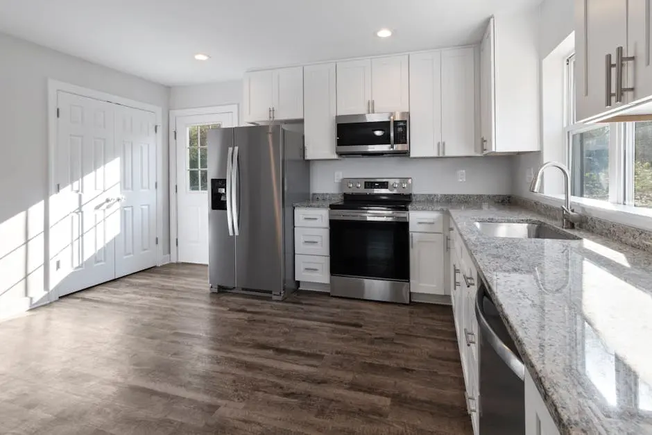 Bright and spacious modern kitchen featuring stainless steel appliances and granite countertops.