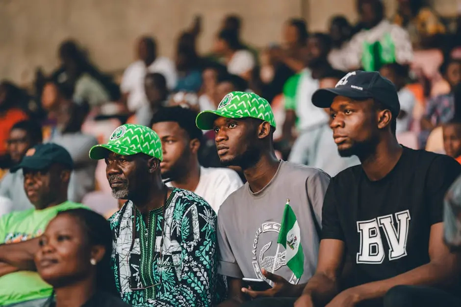 Capturing Nigerian football fans in vibrant green attire, showcasing cultural pride and excitement.
