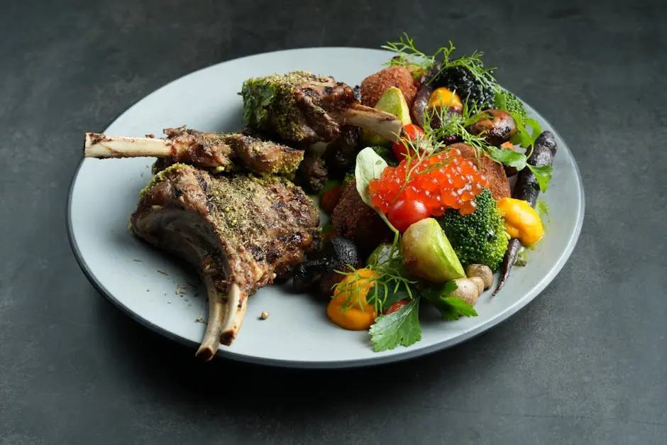 Delicious grilled lamb chops served with a variety of fresh vegetables, perfect for a gourmet meal.