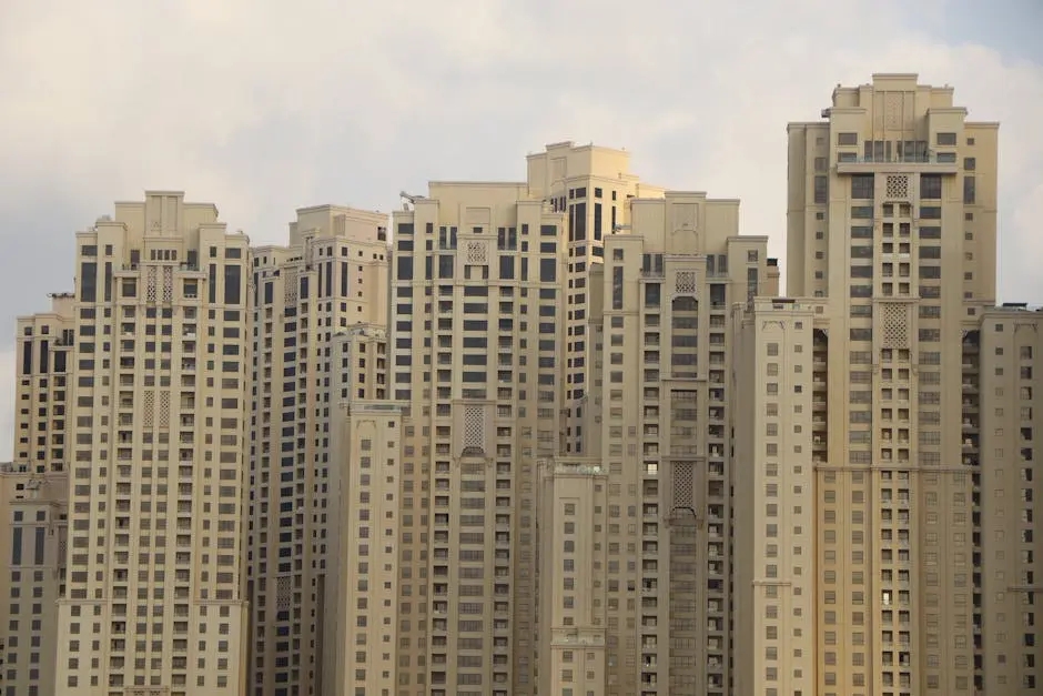 Tall residential skyscrapers characterize the iconic skyline of Dubai Marina, UAE.