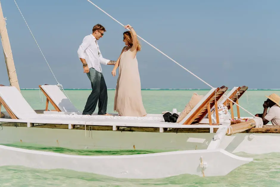 A couple enjoys a romantic moment on a traditional dhow in Zanzibar’s clear waters.