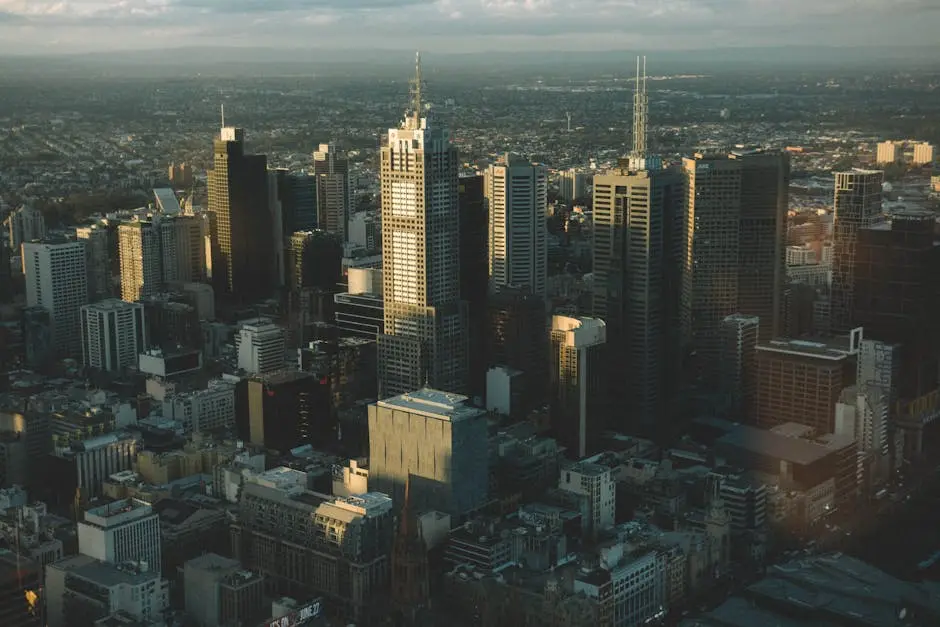 High-angle cityscape of Melbourne’s skyline with modern skyscrapers at dusk.