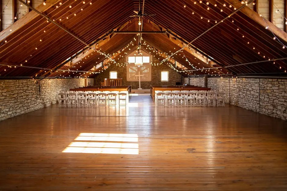 Beautifully decorated chapel with wooden beams and string lights for a serene ceremony setting.