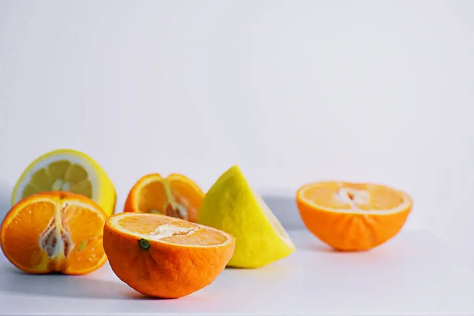 Colorful citrus slices including oranges and lemons displayed on a white background.