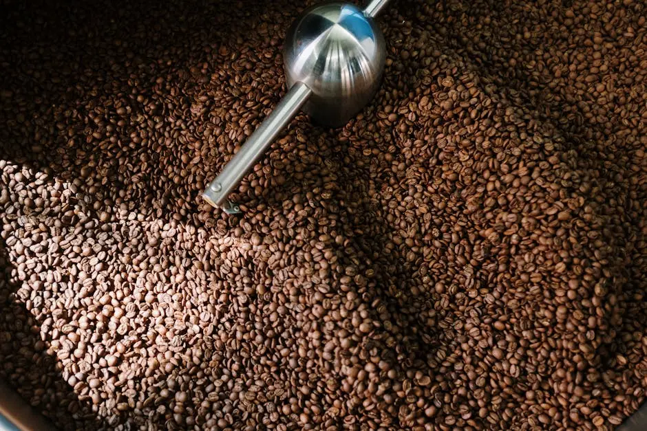 Detailed image of roasted coffee beans spinning inside a professional coffee roaster.