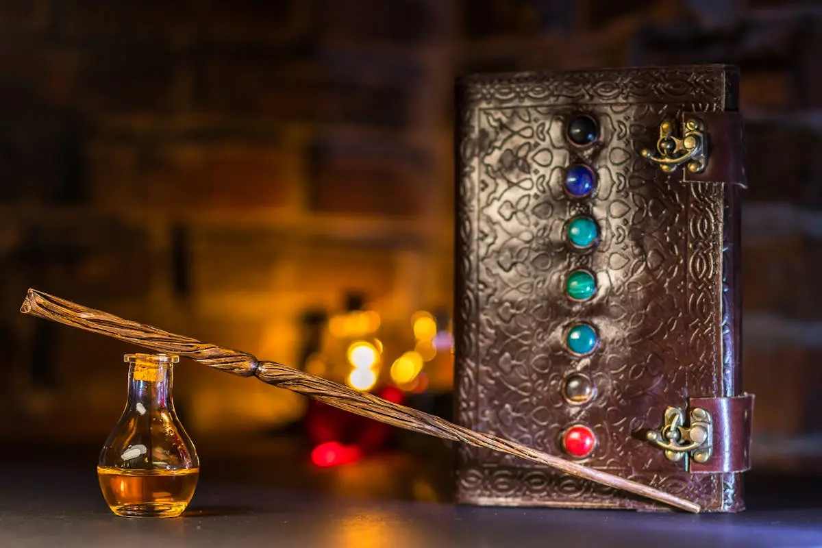 Close-up of a wizard’s wand and potion with a magical spell book on a rustic background.