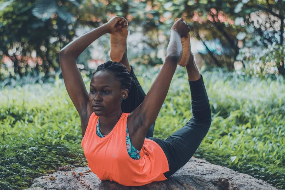 A woman practicing a yoga pose outdoors, emphasizing flexibility and fitness.