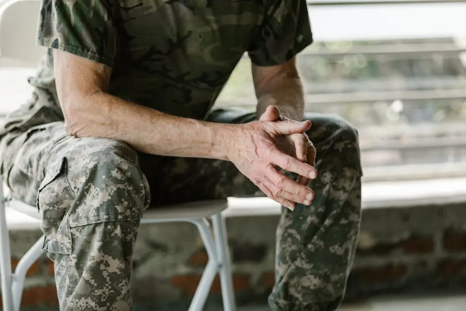 Close-up of a military veteran&rsquo;s hands in a therapy session, emphasizing mental health support.