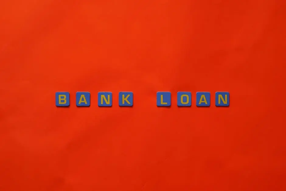 Letters forming ‘Bank Loan’ on a vibrant red surface, ideal for finance themes.