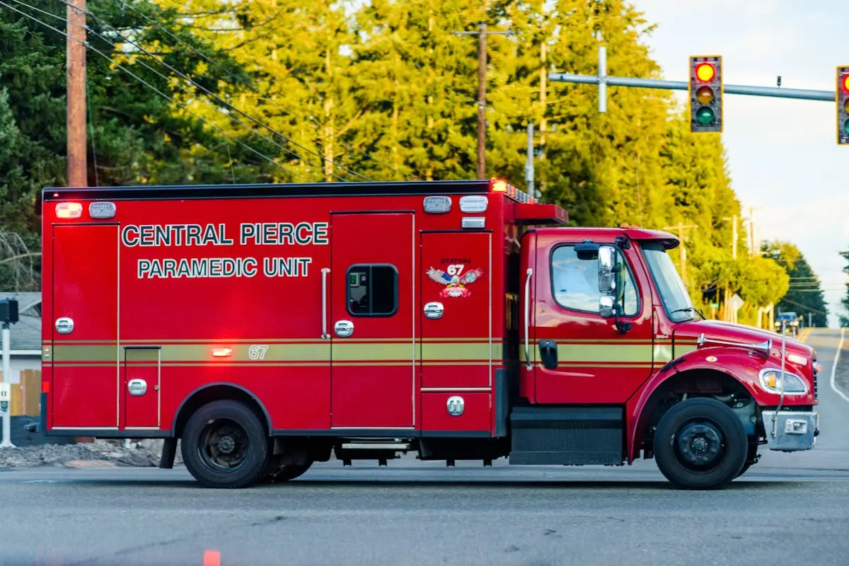 Red paramedic truck from Central Pierce seen at an intersection, providing emergency services.