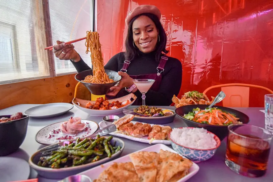 A woman savoring a delightful Asian cuisine meal at a New York City restaurant.