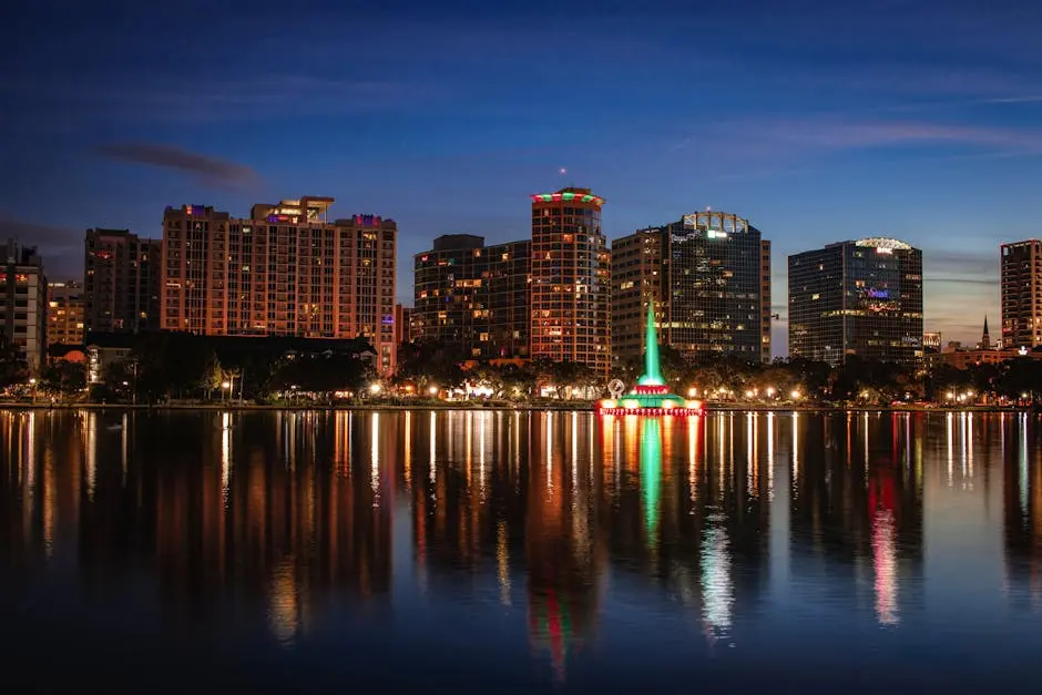 Beautiful view of Orlando skyline at dusk with reflections on Lake Eola.