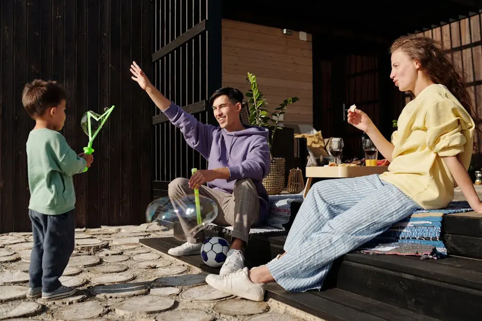 Family enjoying outdoor fun with bubbles, snacks, and playful activities. Perfect for lifestyle themes.