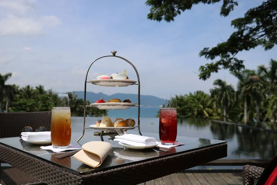 Enjoy a delightful afternoon tea with pastries and drinks by a serene lakeside setting.