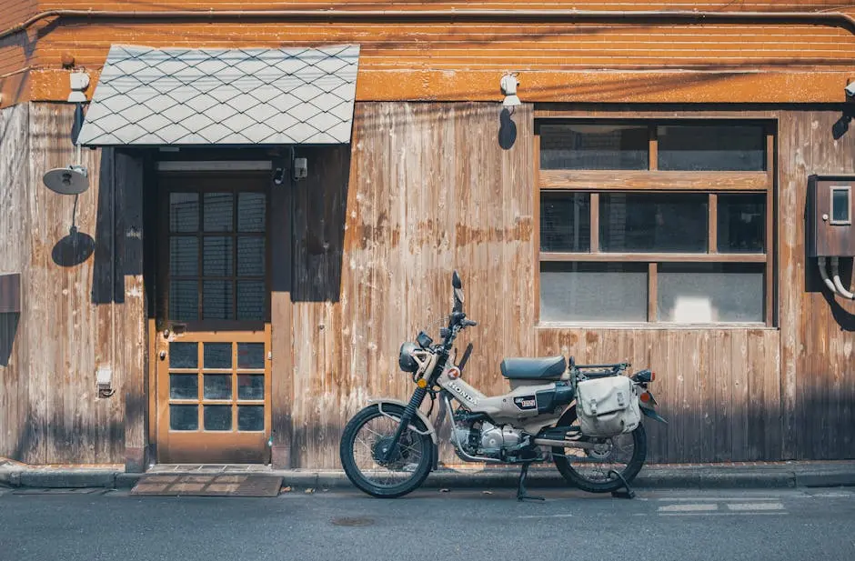 A vintage motorcycle parked outside a wooden shop in Tokyo’s Chiyoda district.