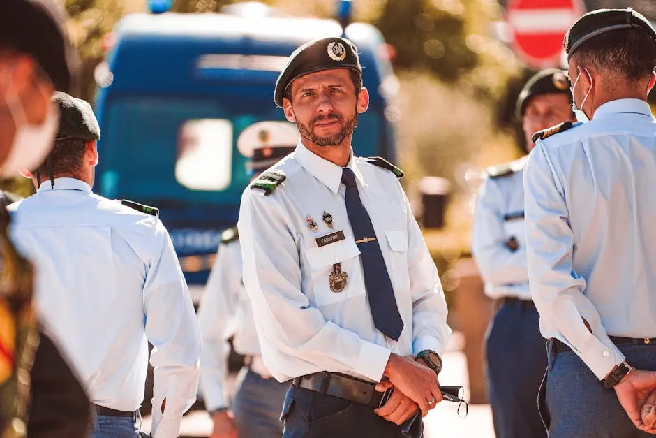 A group of uniformed officers gathered outdoors for a meeting or event.